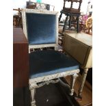 A classical style high back chair with blue upholstery