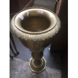 A brass plant stand