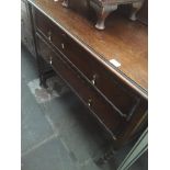 An oak dressing table with swing mirror
