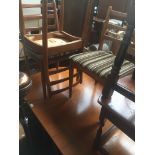 A teak drop leaf dining table and four chairs