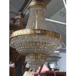 A modern gilt metal and glass chandelier