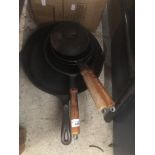 A set of cast metal cooking pans