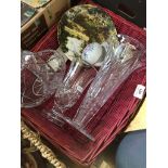 A basket containing 3 glass items and some ceramics.