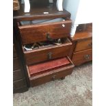 A narrow chest of drawers - full of plated cutlery