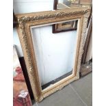 A large gilt picture frame inner measurements 91cm x 61cm Catalogue only, live bidding available via