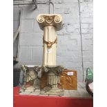 Resin Corinthian column stands and a ceramic wall pocket Catalogue only, live bidding available