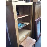 A large light oak modern bookcase with lower cupboard Catalogue only, live bidding available via our