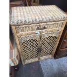 A wicker cabinet Catalogue only, live bidding available via our website. If you require P&P please