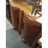 A 1930s oak sideboard Catalogue only, live bidding available via our website. If you require P&P