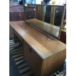 A mid 20th century G-Plan teak dressing table and stool Catalogue only, live bidding available via