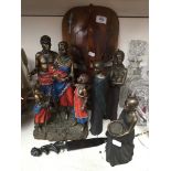 Four Soul Journeys figures and two carve masks Catalogue only, live bidding available via our