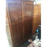 An oak double wardrobe Catalogue only, live bidding available via our website. If you require P&P