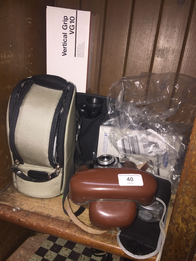 A vintage camera, Samsung digi camera, binoculars, etc Catalogue only, live bidding available via