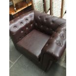 A brown leatherette Chesterfiled armchair Catalogue only, live bidding available via our website. If