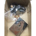 A box containing Victorian silver coin brooches, horn nurses buttons, and copper printing block