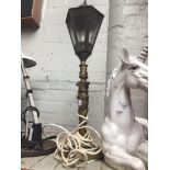 A brass lantern style table lamp Catalogue only, live bidding available via our website. If you