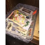 A box of post cards and cigarette cards Catalogue only, live bidding available via our website. If