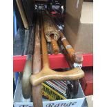 A bundle of walking sticks to include 2 with silver collars and a wooden parasol Catalogue only,