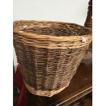 A wicker basket Catalogue only, live bidding available via our website. If you require P&P please