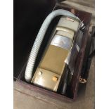 A vintage Electrolux Automatic 310 cylinder vacuum cleaner in wooden case. Catalogue only, live