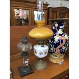 Two oil lamps Catalogue only, live bidding available via our website. If you require P&P please read