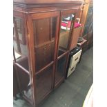 An Edwardian mahogany display cabinet. Catalogue only, live bidding available via our website. If