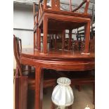 A Chinese style hardwood extending dining table with six chairs Catalogue only, live bidding