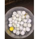 A tub of over 100 golf balls Catalogue only, live bidding available via our website. If you