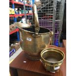 A brass coal bucket and brass planter