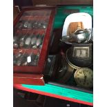 A box of misc items to include clocks, barometer, glazed cabinet containing collector's spoons,