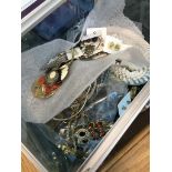 A clear box full of costume necklaces and earrings Catalogue only, live bidding available via our