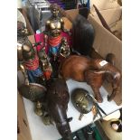 A collection of African figures, wooden animals and brass masks, etc. Catalogue only, live bidding