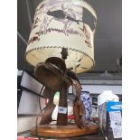 A cowboy desk lamp. Catalogue only, live bidding available via our website. If you require P&P
