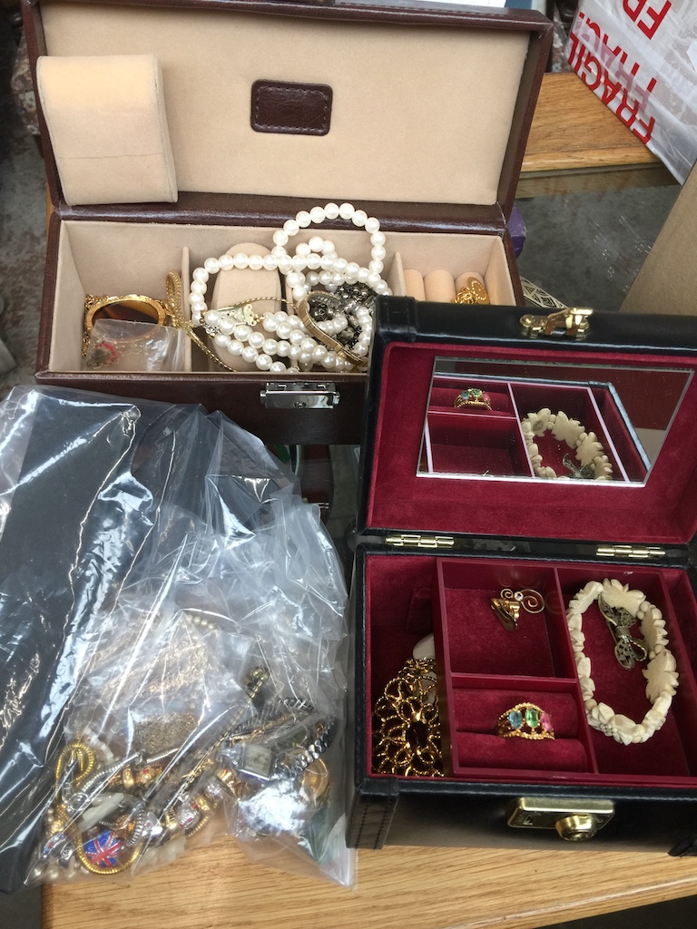 Two jewellery boxes and a bag of costume jewellery Catalogue only, live bidding available via our