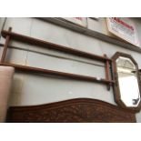 A carved oak framed bevelled mirror and a two tier plate rack Catalogue only, live bidding available