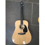 A Fender Squier acoustic guitar Catalogue only, live bidding available via our website. If you