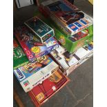 A collection of games to include Matchbox Power track, Johnny Hot Shot, Hangman, crossword cubes,