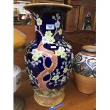 A large ceramic vase. Catalogue only, live bidding available via our website. If you require P&P