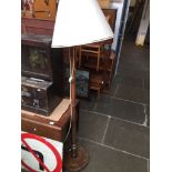 A stained beech lamp standard. Catalogue only, live bidding available via our website. If you