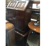 An oak bureau with linen fold panels and an oak drop leaf table Catalogue only, live bidding