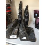 Pair of bookends and four Egyptian style figures Catalogue only, live bidding available via our