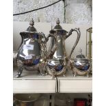A silver plated tea/coffee set Catalogue only, live bidding available via our website. If you