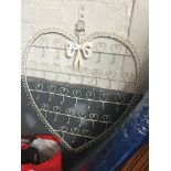 A heart shaped metal key hanger Catalogue only, live bidding available via our website. If you