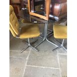 A Peak Furniture Crafts Ltd retro chrome and smoked glass hexagonal dining table with four mustard