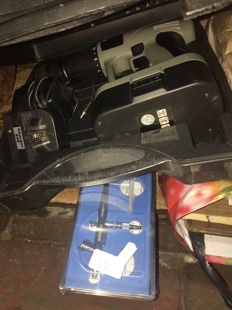 A cased cordless drill and an air brush Catalogue only, live bidding available via our website. If