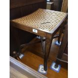 A reproduction bergere stool with x frame stretcher. Catalogue only, live bidding available via