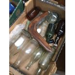 Box with glass bottles and a boomerang Catalogue only, live bidding available via our website. If