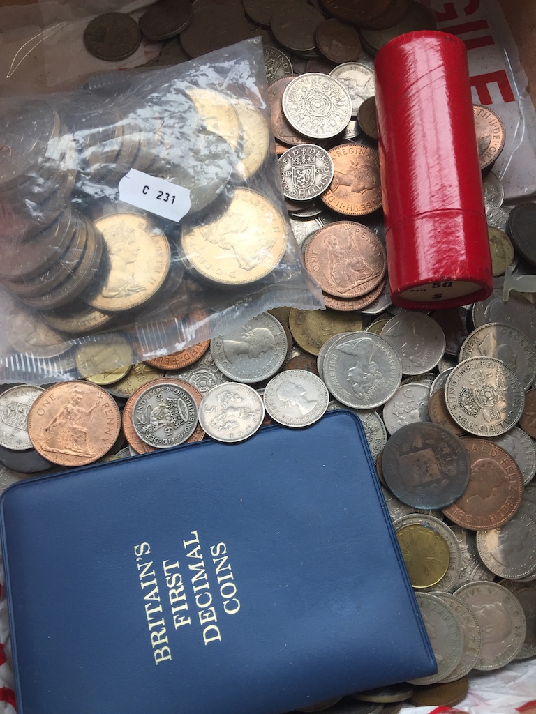 A box with large collection of coins to include silver. Catalogue only, live bidding available via