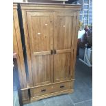 A modern light oak wardrobe Catalogue only, live bidding available via our website. If you require