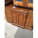 A reproduction breakfront walnut cabinet of small proportions. Catalogue only, live bidding